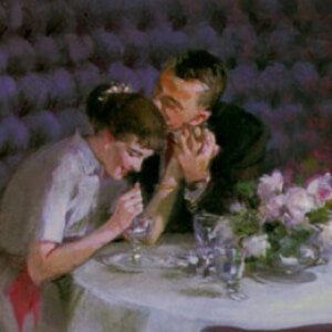 Romantic couple in fancy restaurant, she eating dessert - John Gannam